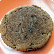 Load image into Gallery viewer, the back of a chocolate chip cookie
