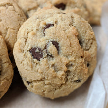 Load image into Gallery viewer, A close up of the perfect chocolate chip cookie waiting to be sent as an eco-friendly gift
