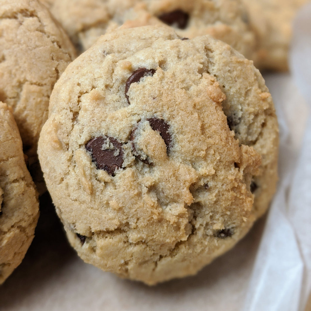 A close up of the perfect chocolate chip cookie waiting to be sent as an eco-friendly gift
